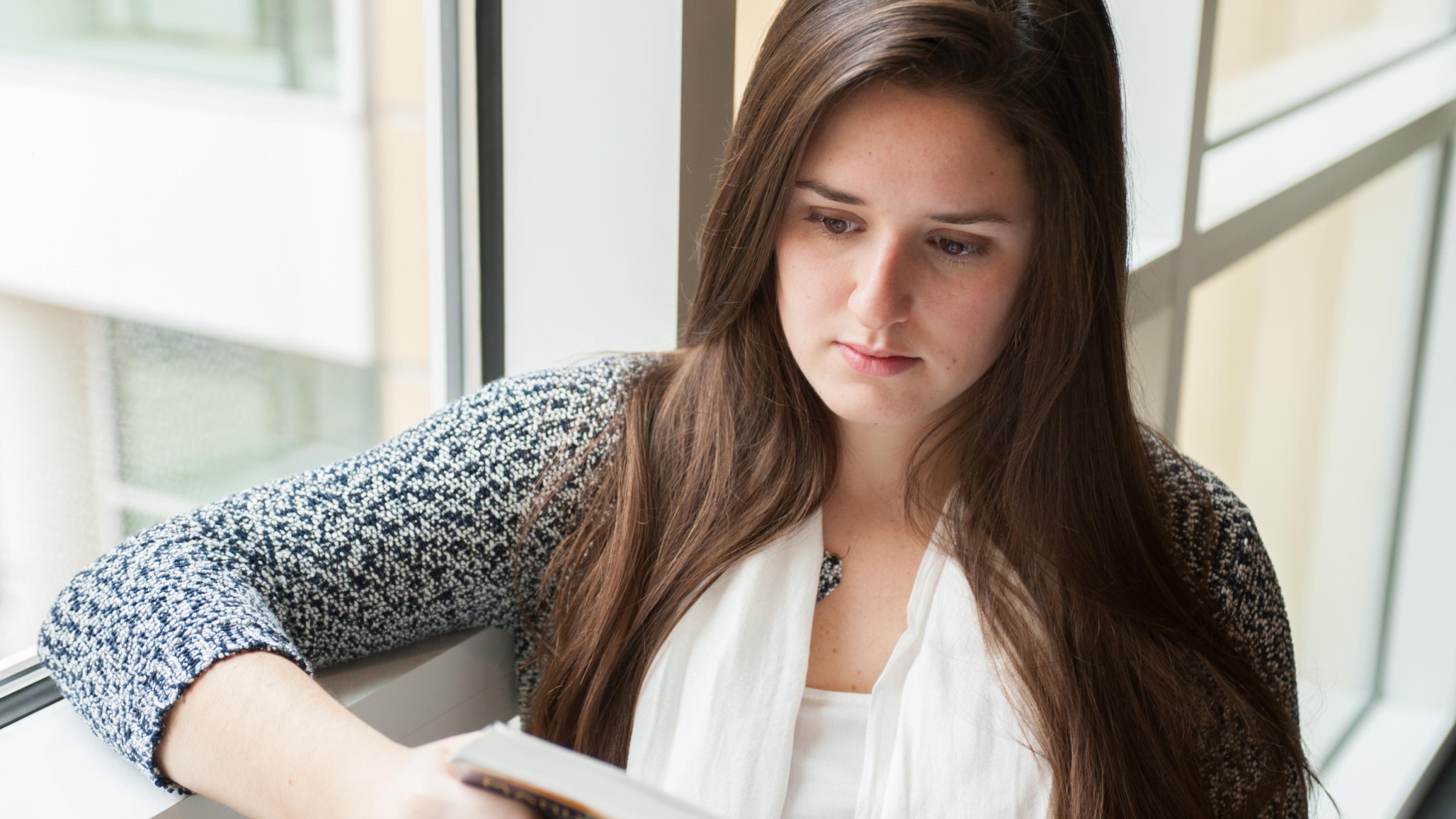 Student Reading in the Scheller College of Business. Photo: Fitrah Hamid